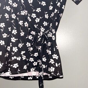 I’m selling a black and white blouse. Brand is Ragdoll and the size is a small